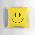 Colorful square throw pillow with a happy face design in a retro, nostalgic style