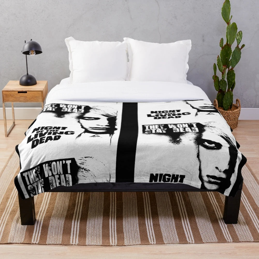 Retro horror-themed plush blanket with zombie movie design