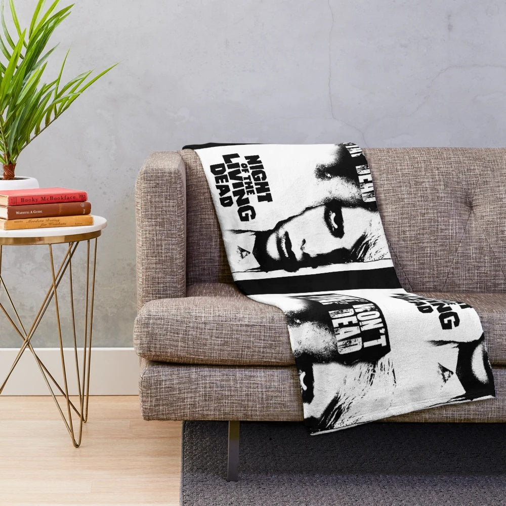 Retro horror-themed plush blanket with zombie movie design
