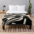 Retro abstract plush blanket in black and cream tones
