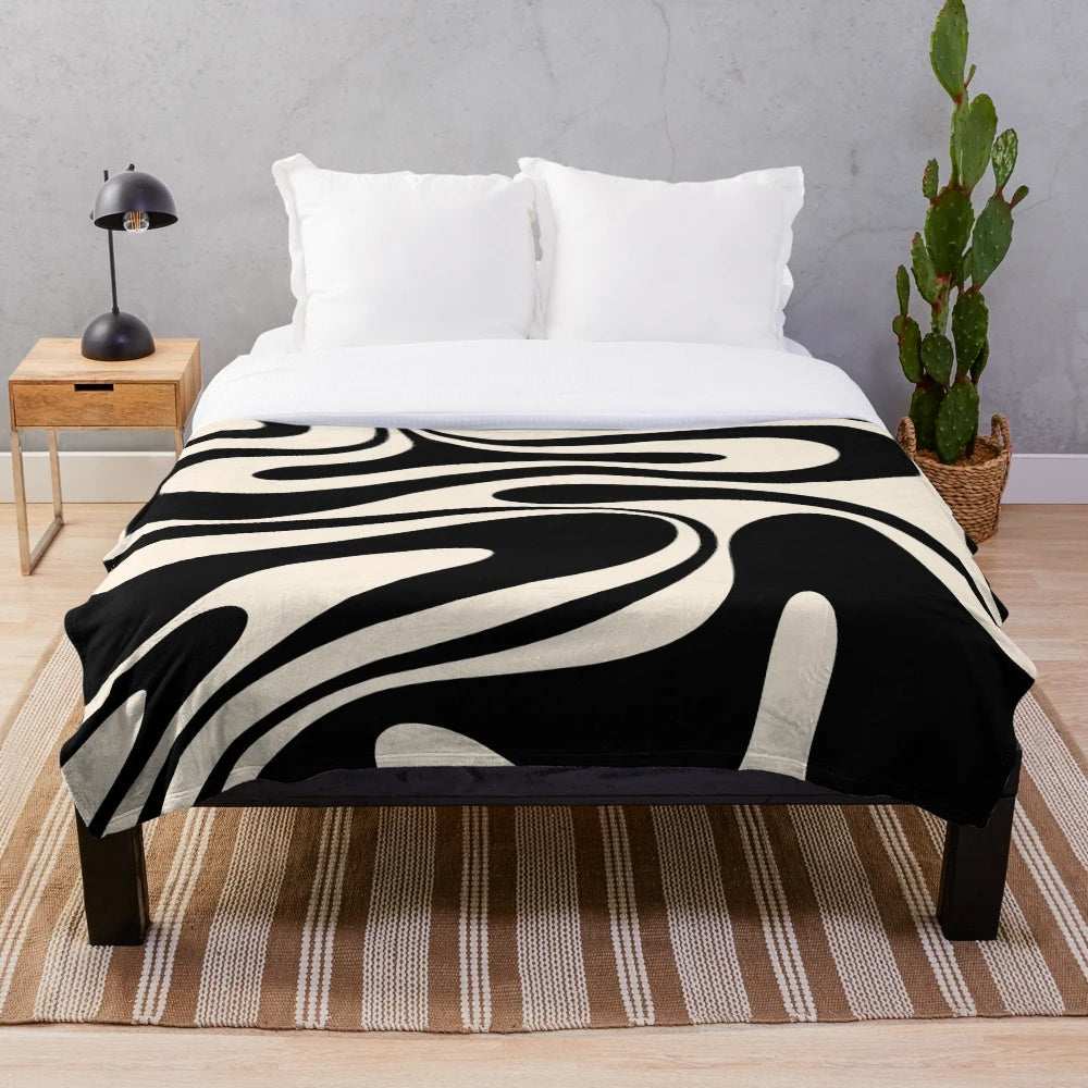 Retro abstract plush blanket in black and cream tones