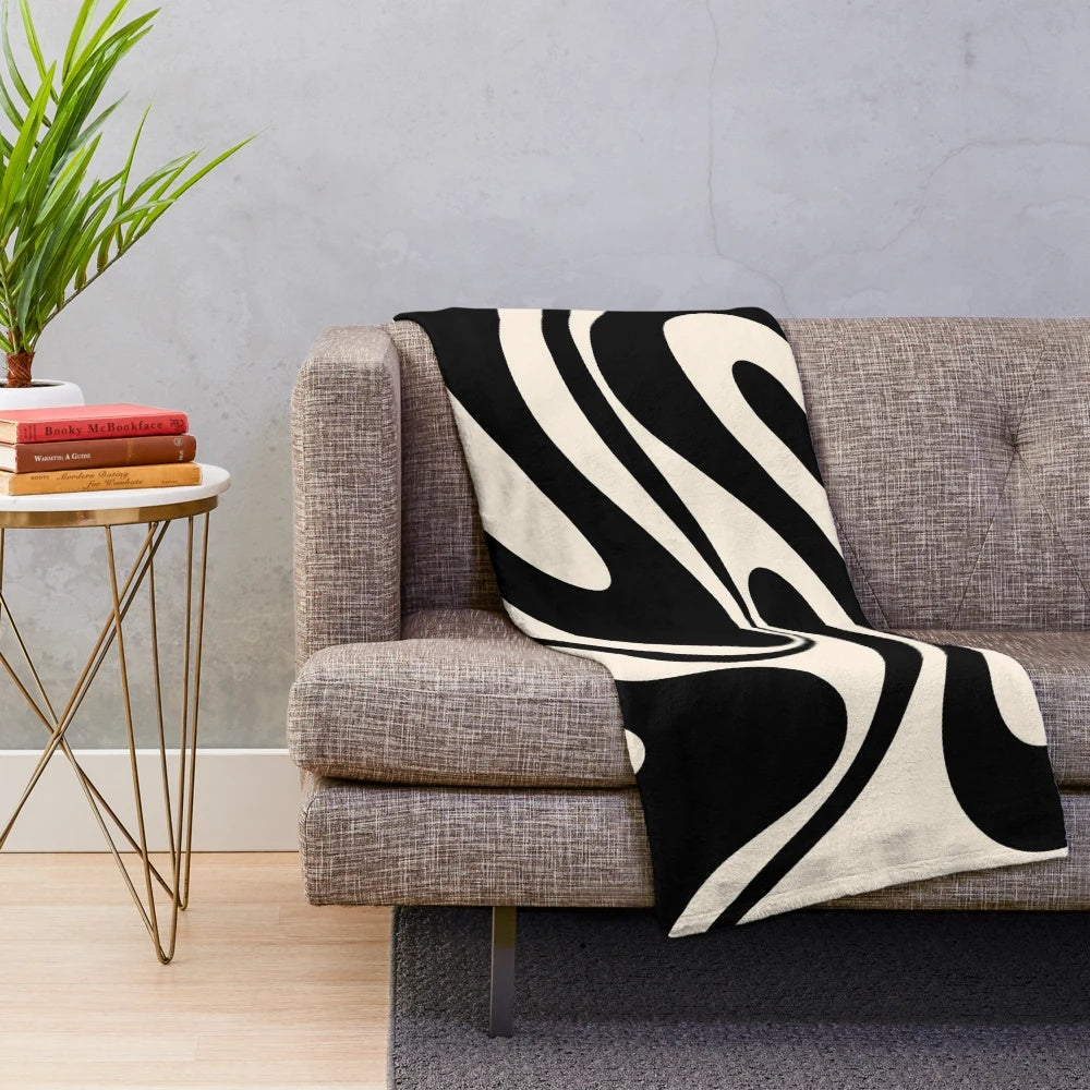 Retro abstract plush blanket in black and cream tones
