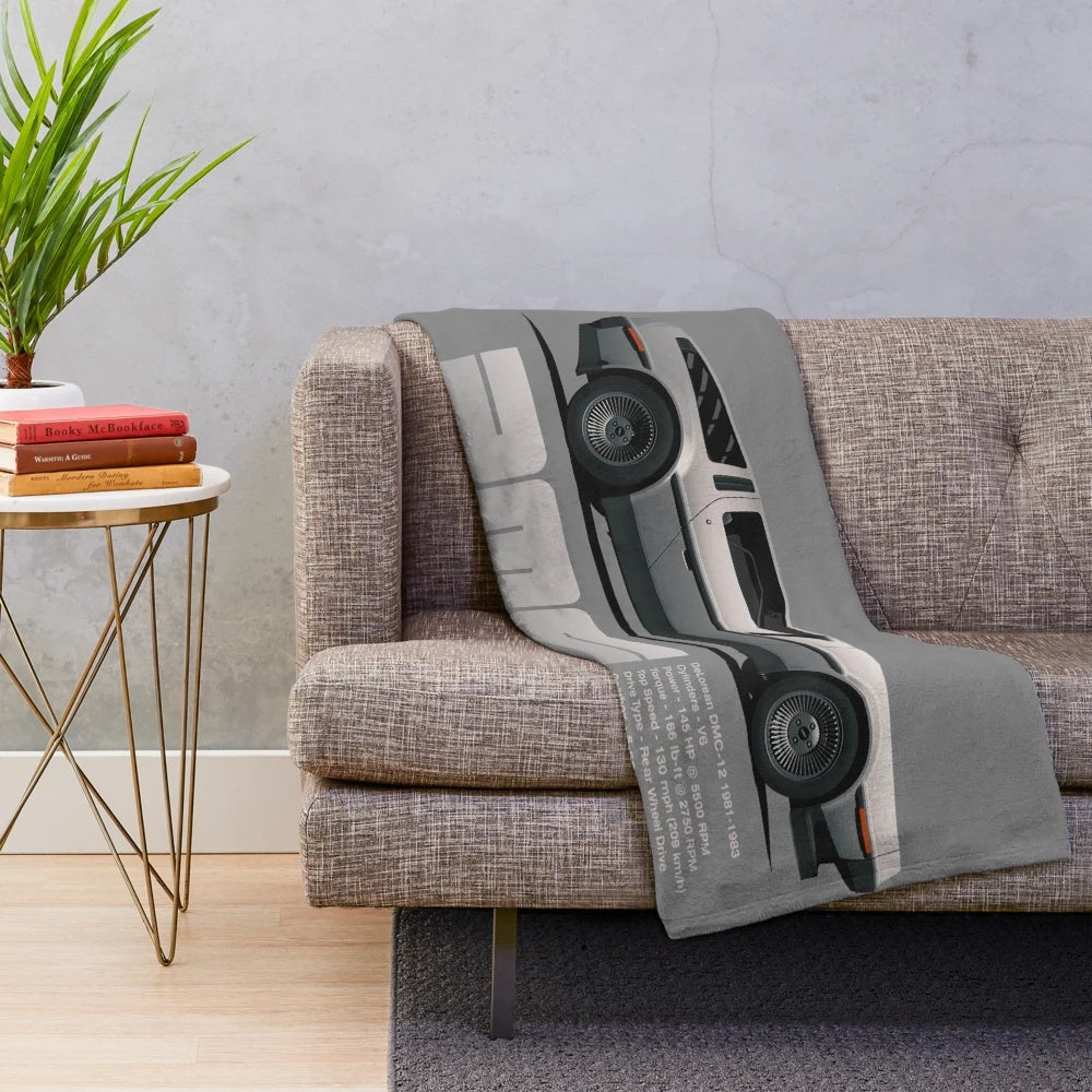 Plush blanket featuring a cartoon-style illustration of a DeLorean DMC-12 car