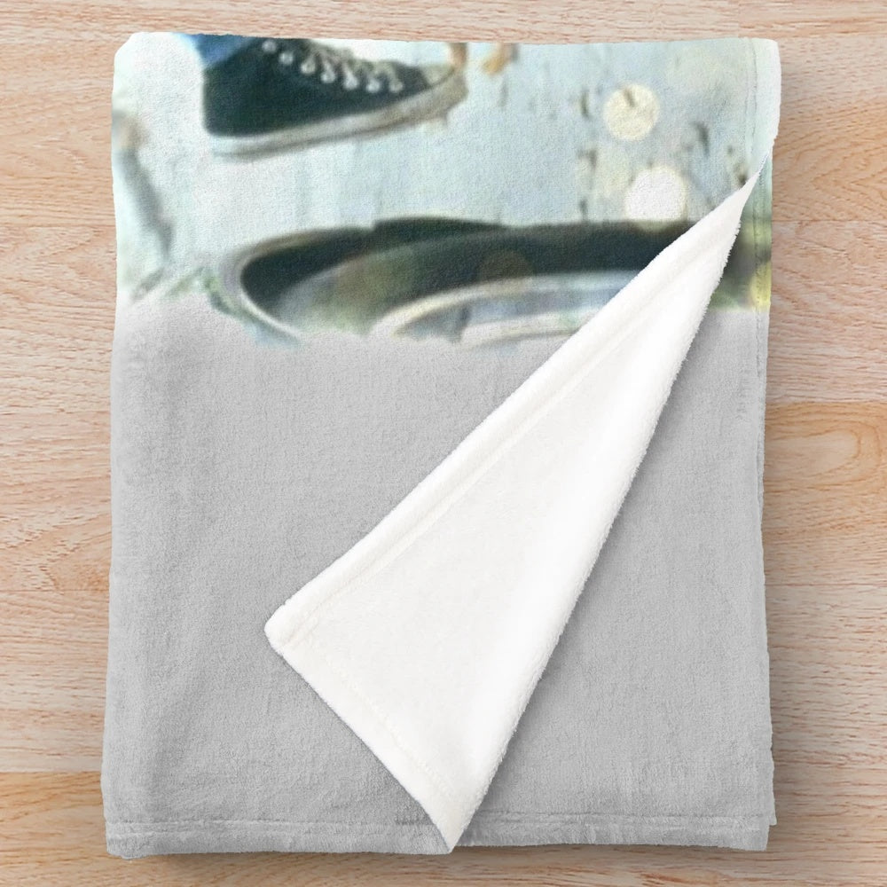 Flashdance-inspired plush blanket with a watercolor design