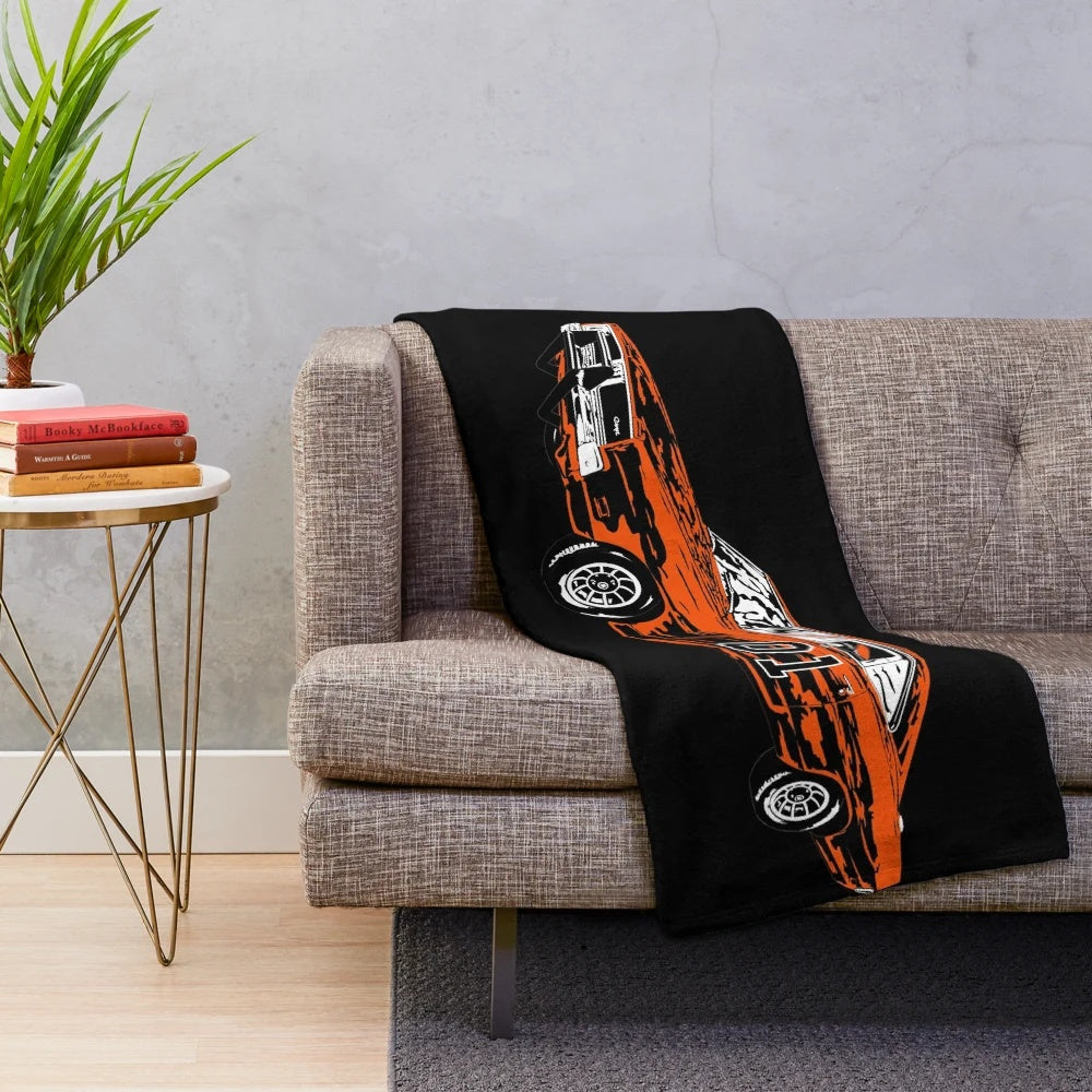 Plush blanket featuring the iconic General Lee car from the Dukes of Hazzard TV series