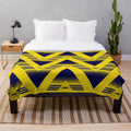 Retro-inspired plush blanket featuring the Arsenal FC logo and colors