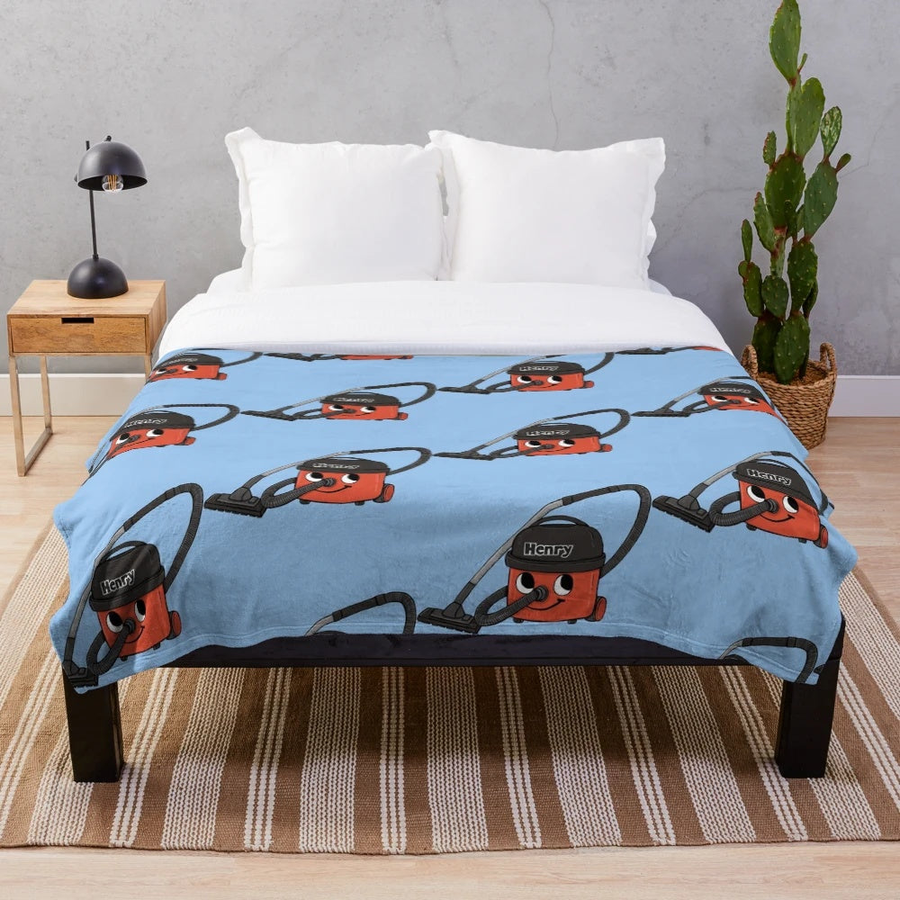 Plush blanket featuring a retro-inspired design of the iconic Henry Hoover vacuum cleaner