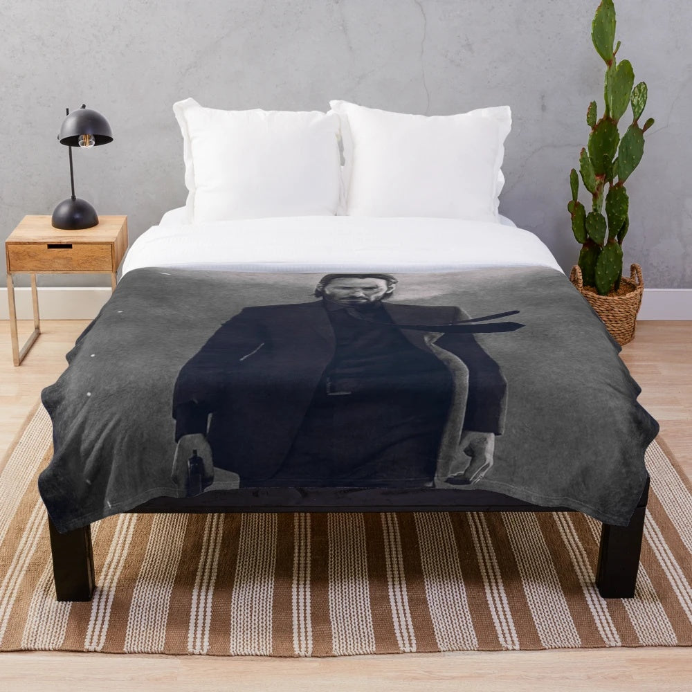 Plush blanket featuring John Wick movie imagery and retro style