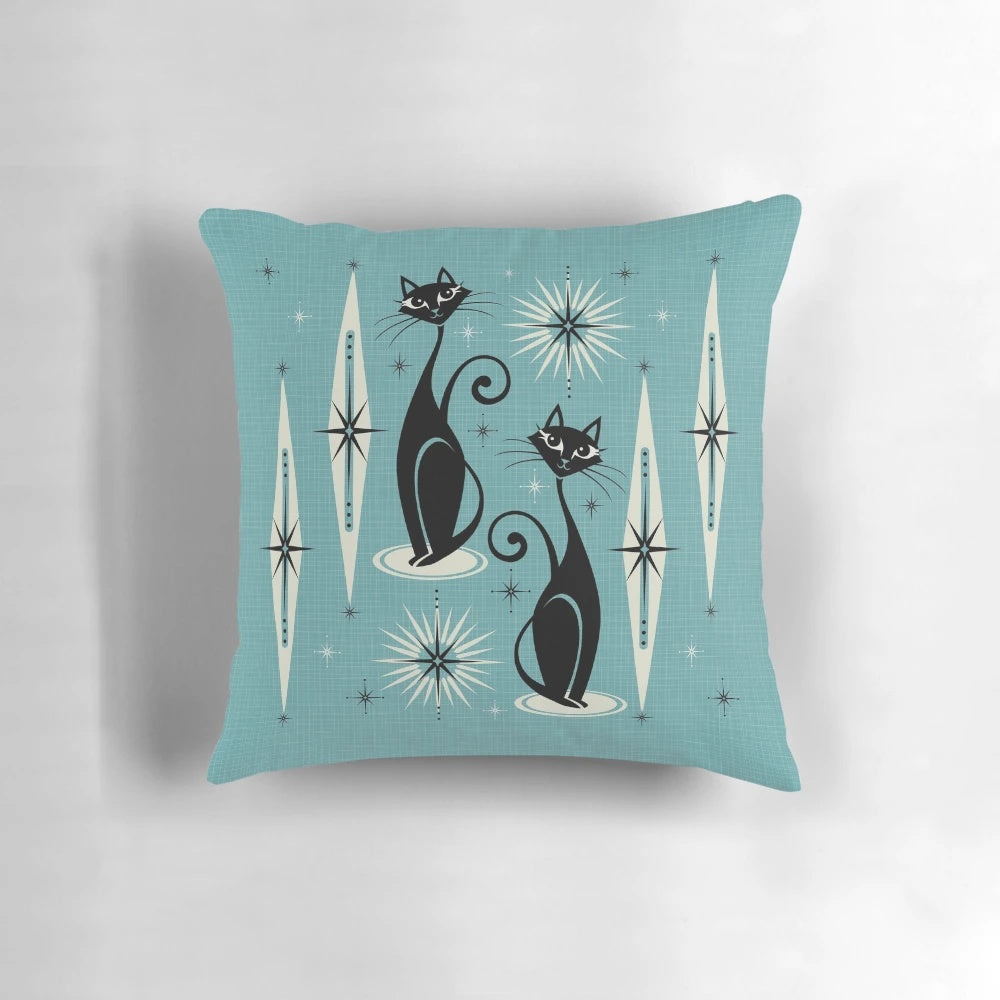 Mid-century inspired throw pillow with atomic cat design in shades of black, gray, and blue