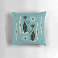 Mid-century inspired throw pillow with atomic cat design in shades of black, gray, and blue