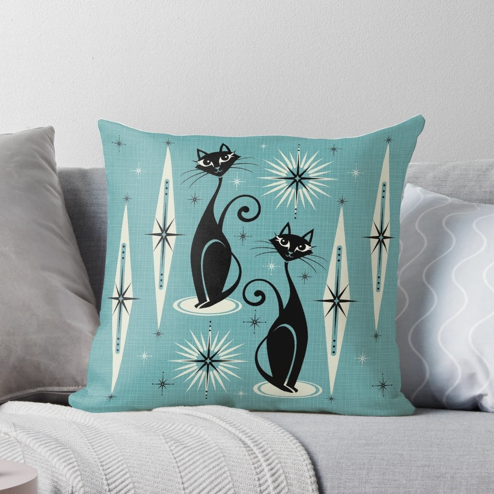 Mid-century inspired throw pillow with atomic cat design in shades of black, gray, and blue