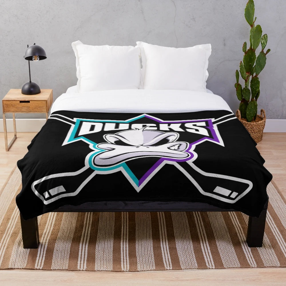 Mighty Ducks themed plush blanket featuring hockey player graphics