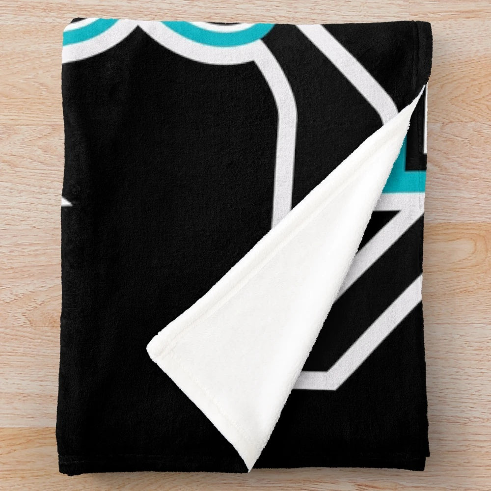 Mighty Ducks themed plush blanket featuring hockey player graphics