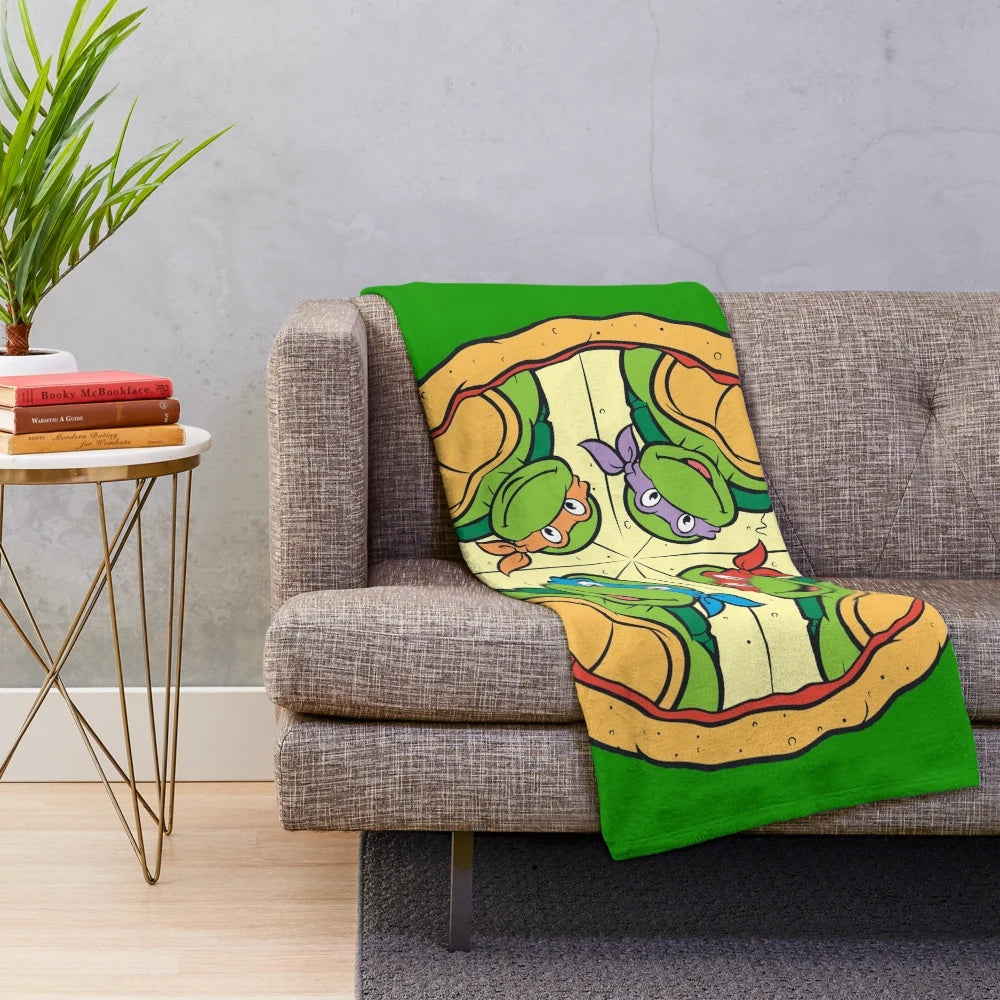 Retro-inspired pizza plush blanket featuring teenage mutant ninja turtles