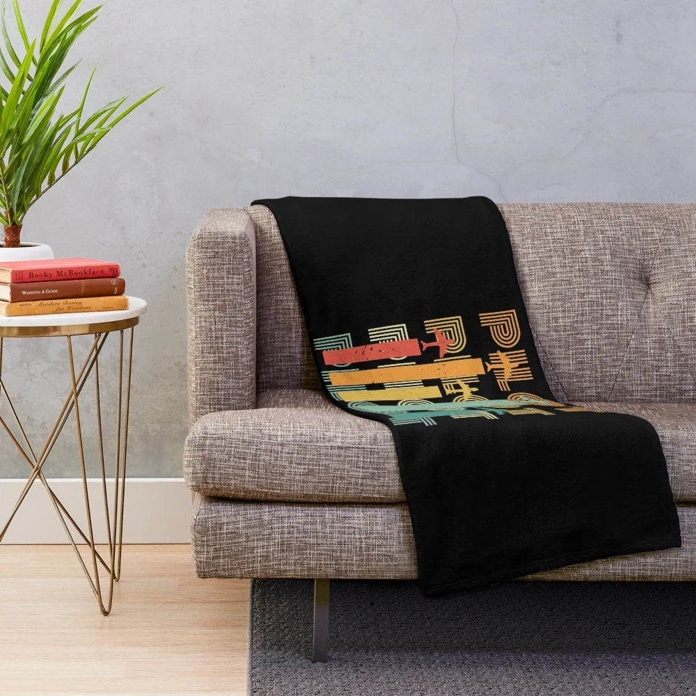 Retro-inspired plush blanket featuring an airplane design, perfect for aviation enthusiasts