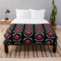 Plush blanket with retro inspired nature-themed design