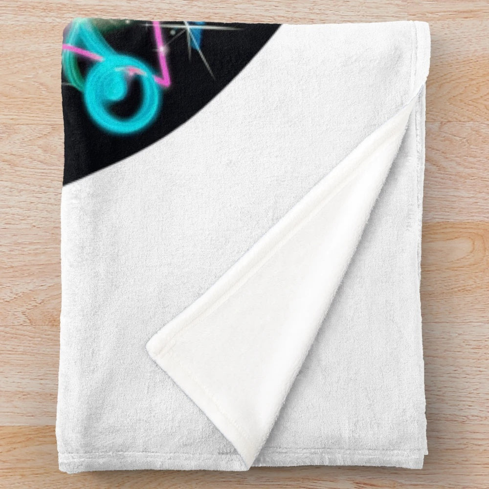Retro 80s style plush blanket with neon colored cassette tape illustration and geometric patterns