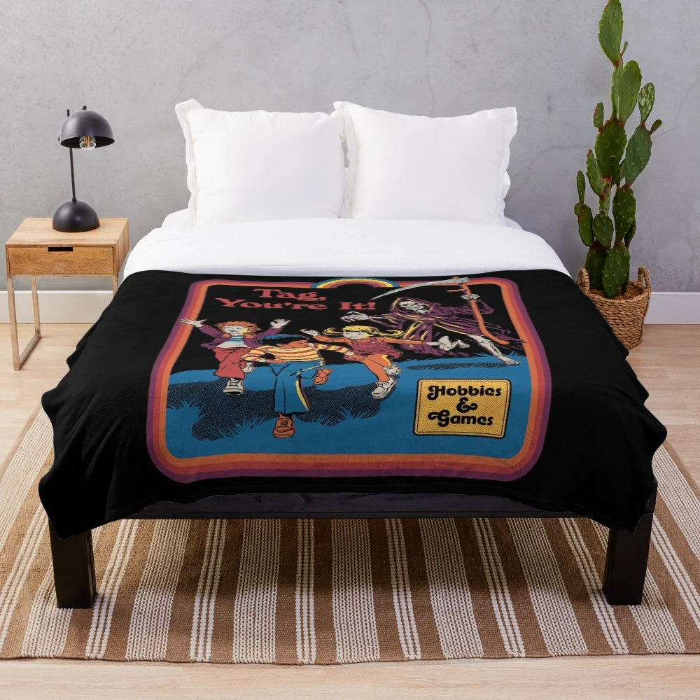 Plush blanket with a retro-inspired, dark humor grim reaper design