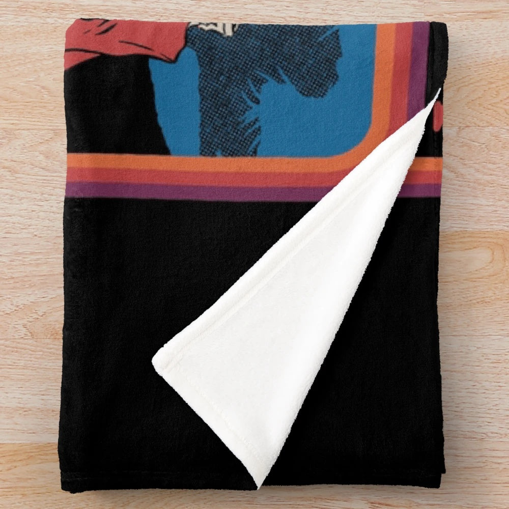 Plush blanket with a retro-inspired, dark humor grim reaper design