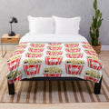 Retro-inspired plush blanket with vintage movie popcorn design