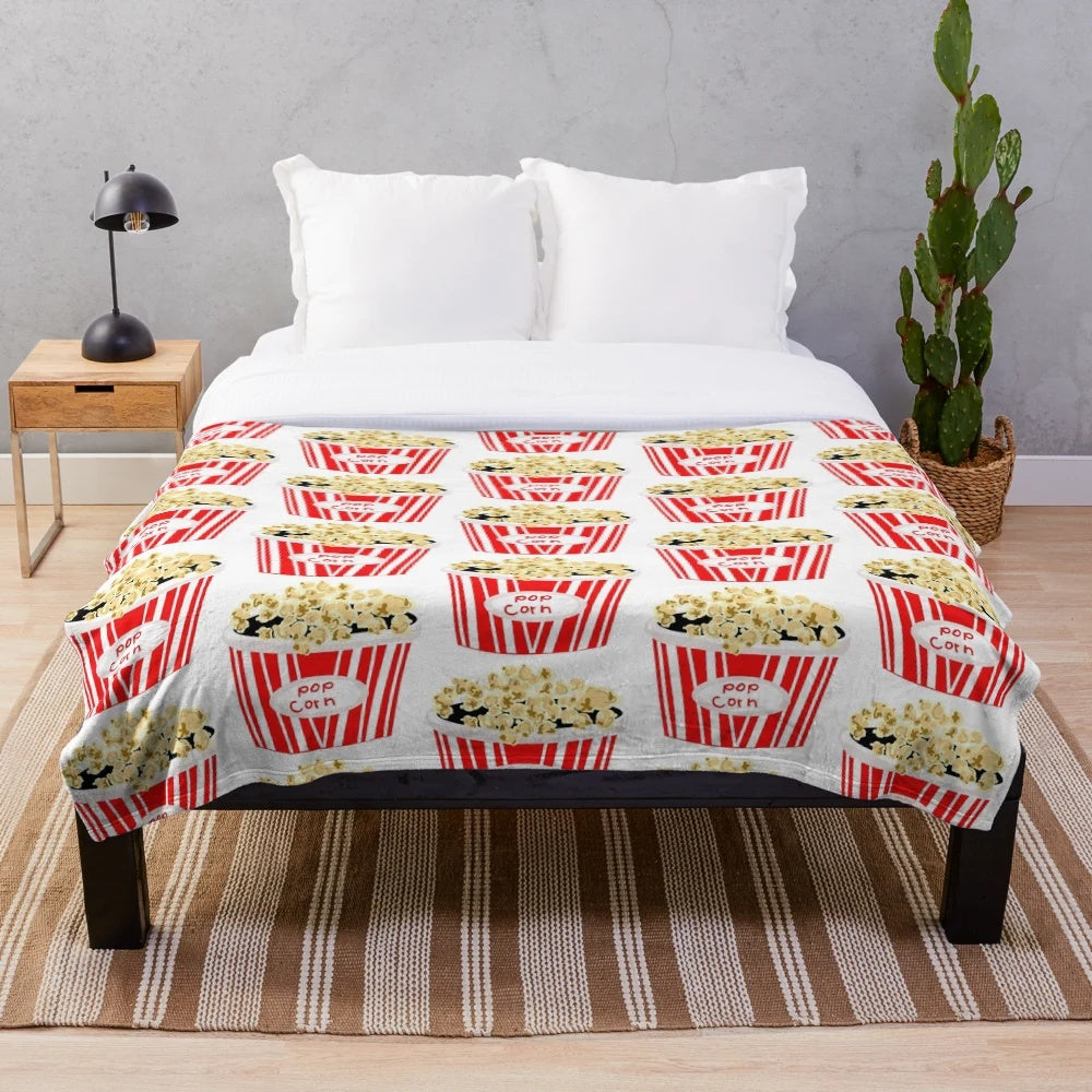 Retro-inspired plush blanket with vintage movie popcorn design