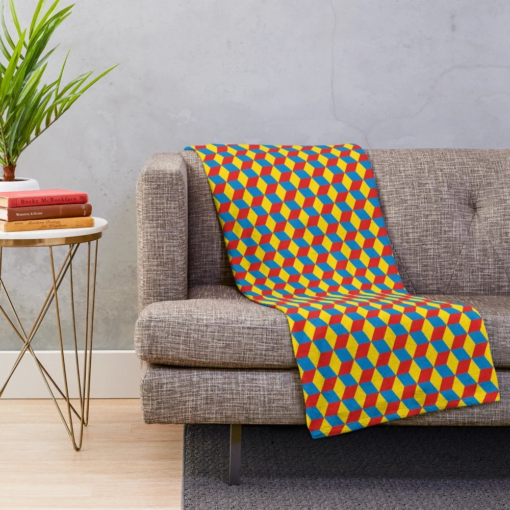 Plush blanket with retro Qbert-inspired 3D cube and color block design