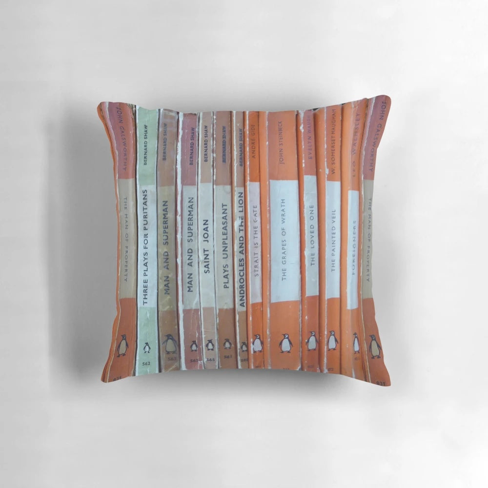 Vintage-style orange throw pillow with a classic book design, perfect for book lovers and literary enthusiasts
