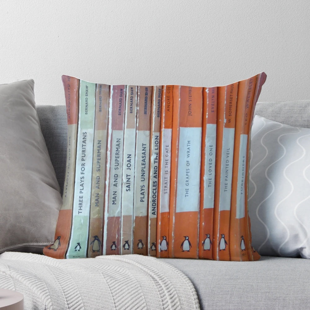 Vintage-style orange throw pillow with a classic book design, perfect for book lovers and literary enthusiasts