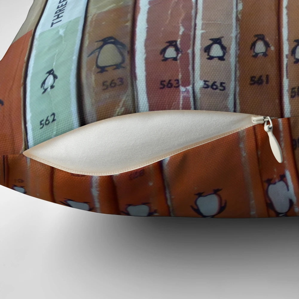 Vintage-style orange throw pillow with a classic book design, perfect for book lovers and literary enthusiasts
