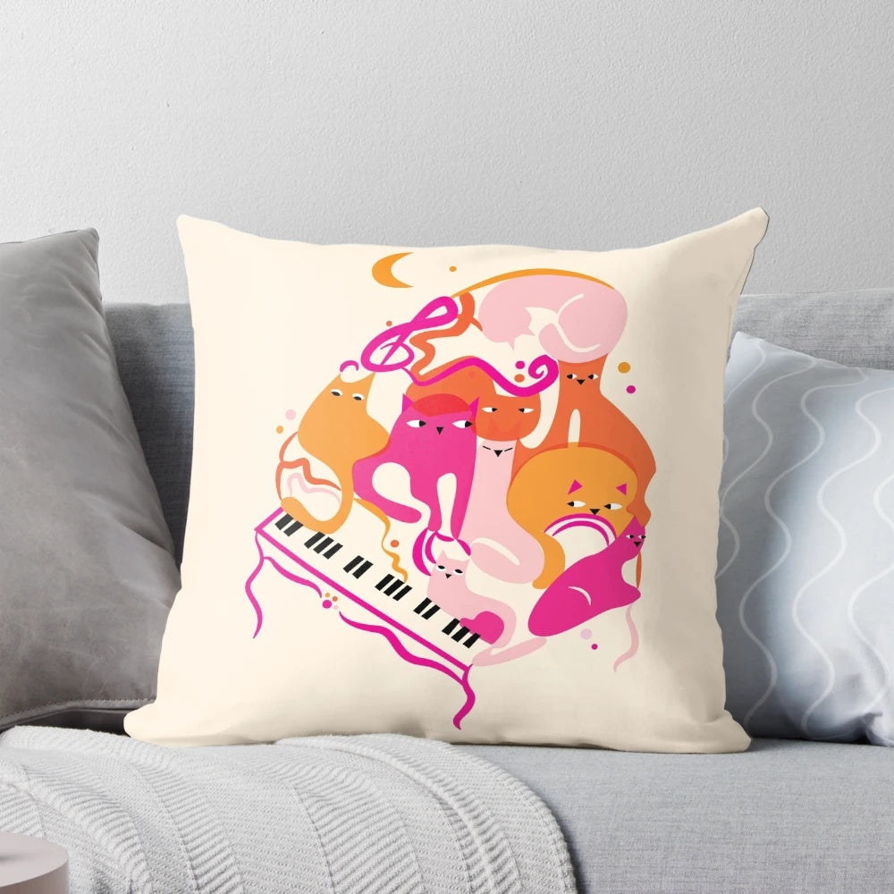 Vibrant pink and orange pillow with jazz cats and piano keys design