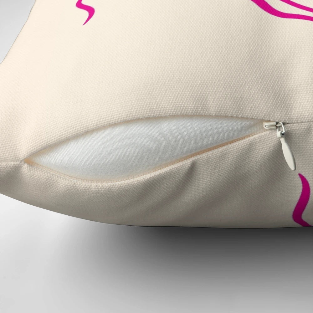 Vibrant pink and orange pillow with jazz cats and piano keys design