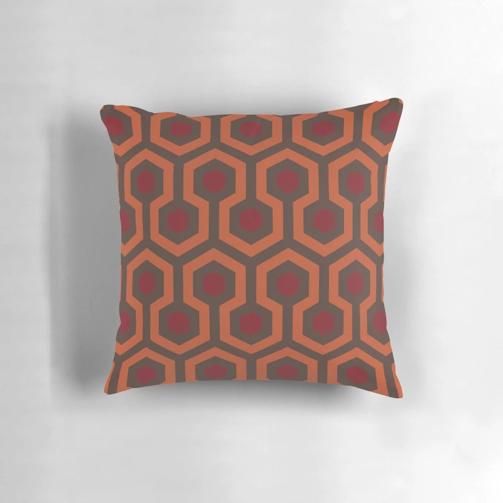 Retro Kubrick-inspired decorative pillow with shining carpet-inspired 1970s horror design