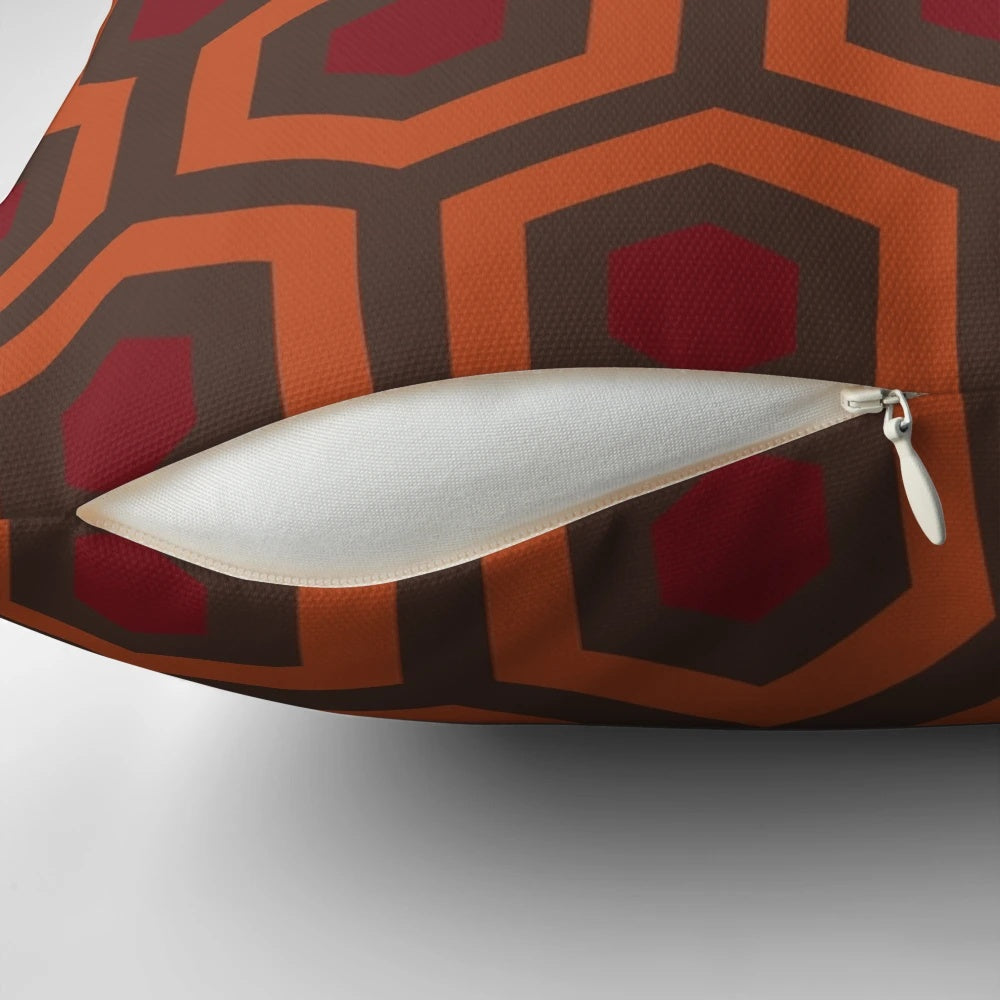 Retro Kubrick-inspired decorative pillow with shining carpet-inspired 1970s horror design