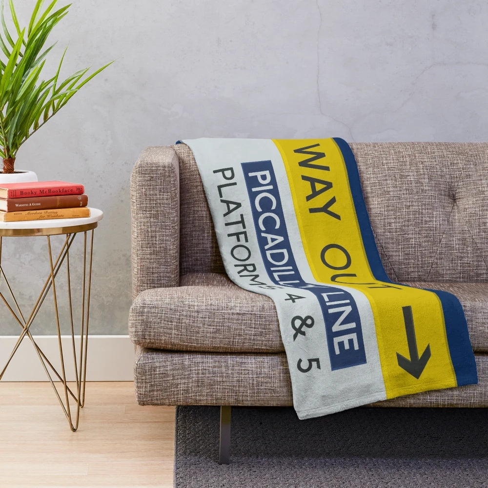 Cozy plush blanket featuring a London Underground Picadilly Line "Way Out" sign design