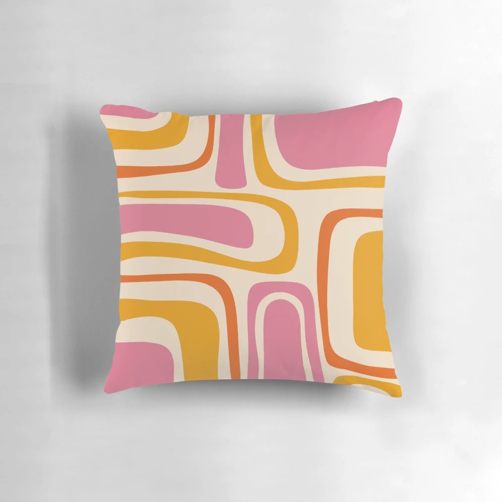 A stylish mid century modern abstract pattern throw pillow in shades of pink and orange