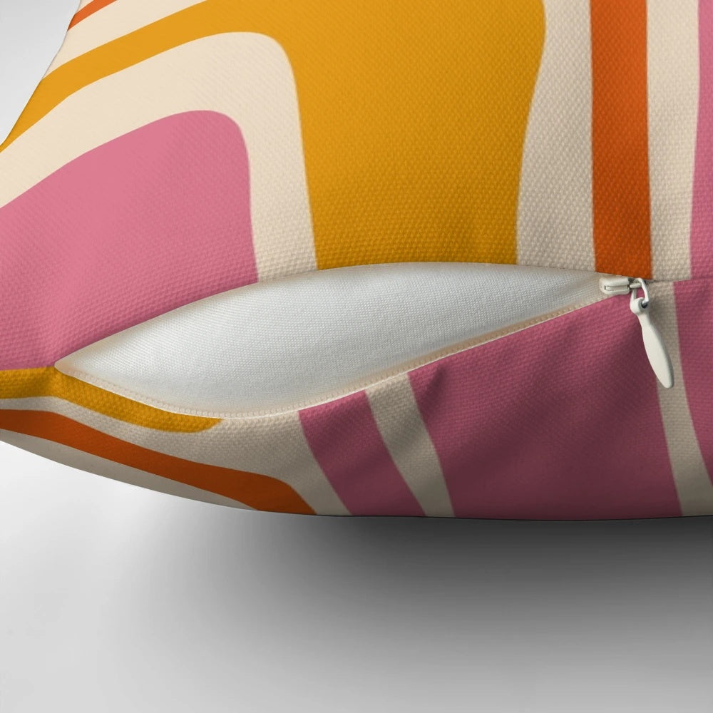 A stylish mid century modern abstract pattern throw pillow in shades of pink and orange