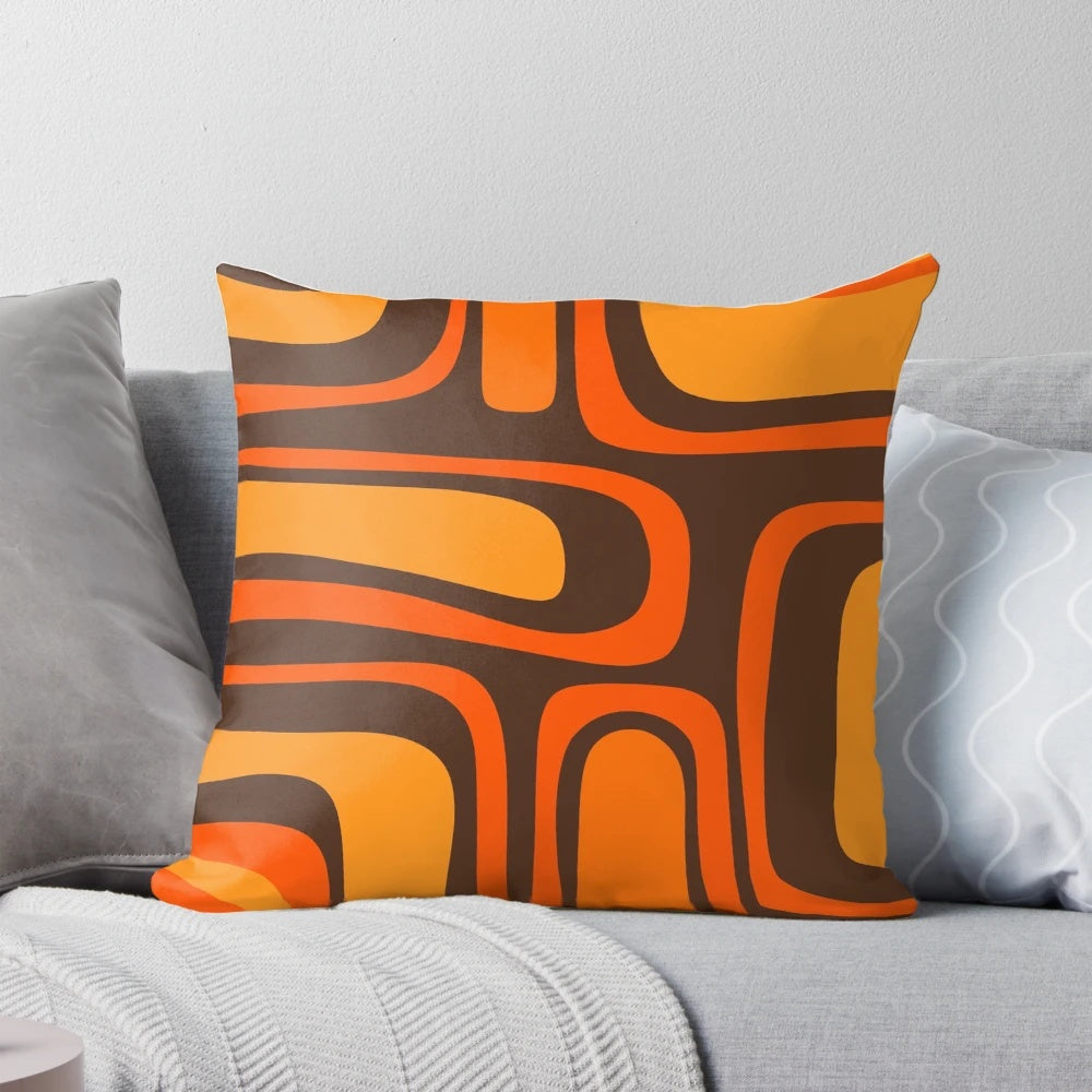 Retro mid-century modern abstract pattern pillow in brown and orange colors