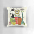 A decorative throw pillow featuring a vintage-inspired illustration of a black cat among houseplants and atomic flowers.