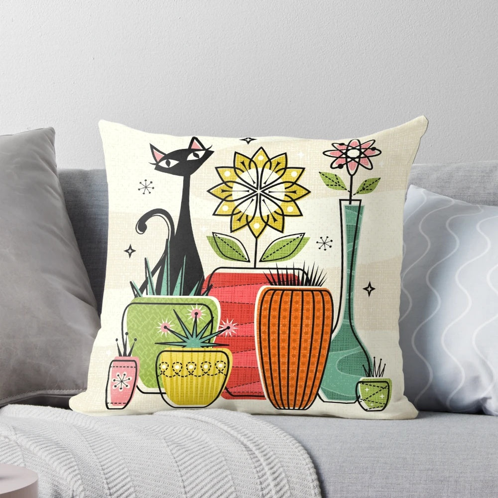 A decorative throw pillow featuring a vintage-inspired illustration of a black cat among houseplants and atomic flowers.