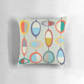 Mid-century modern style throw pillow with geometric pop art design