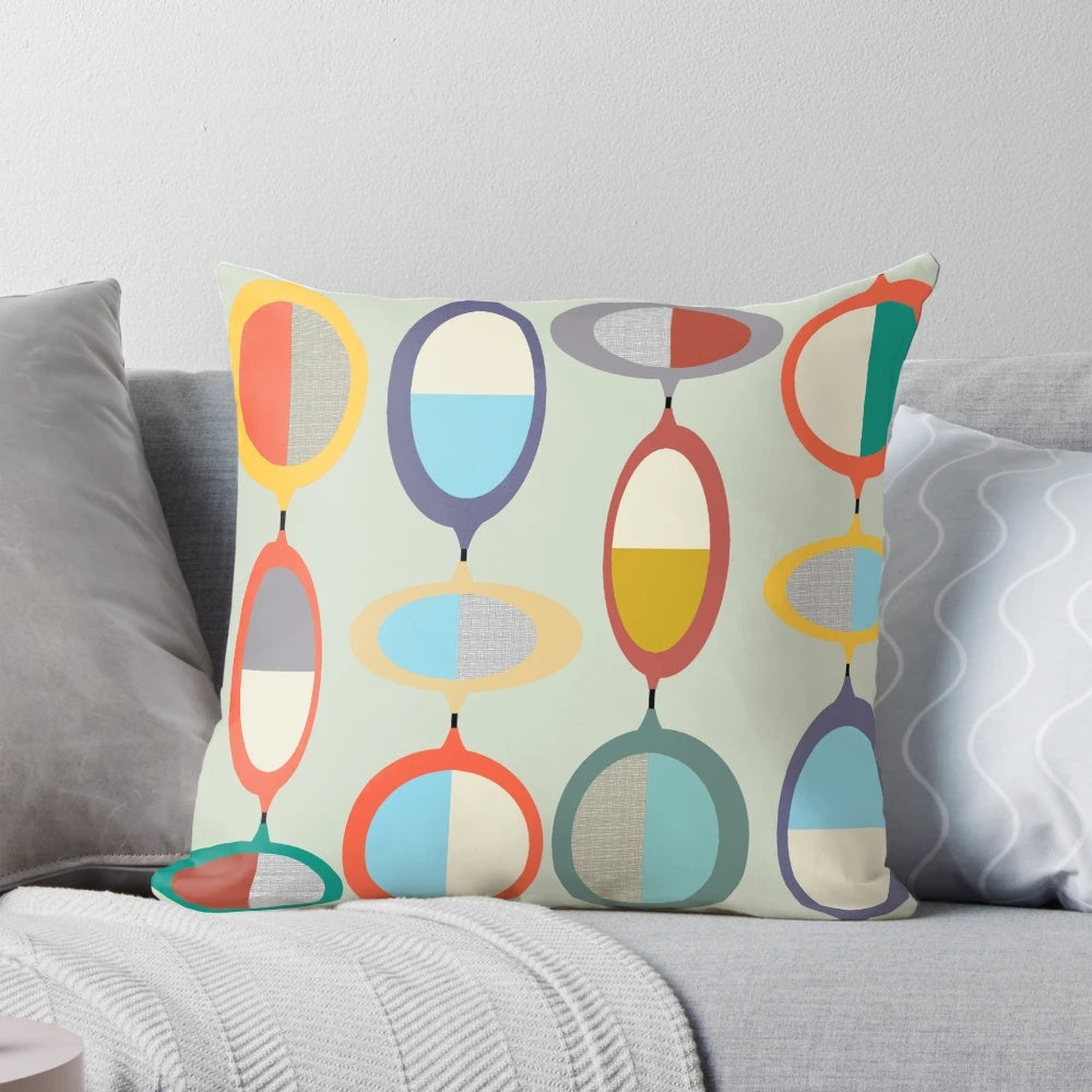 Mid-century modern style throw pillow with geometric pop art design