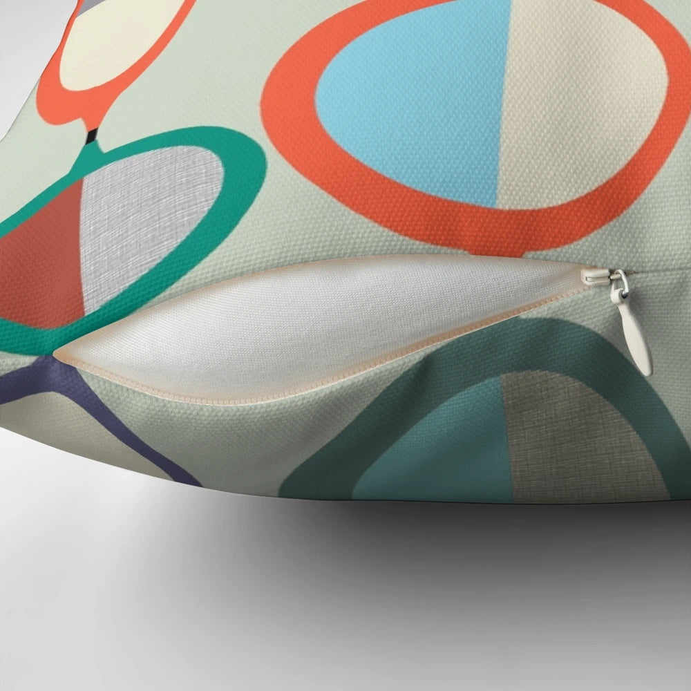 Mid-century modern style throw pillow with geometric pop art design
