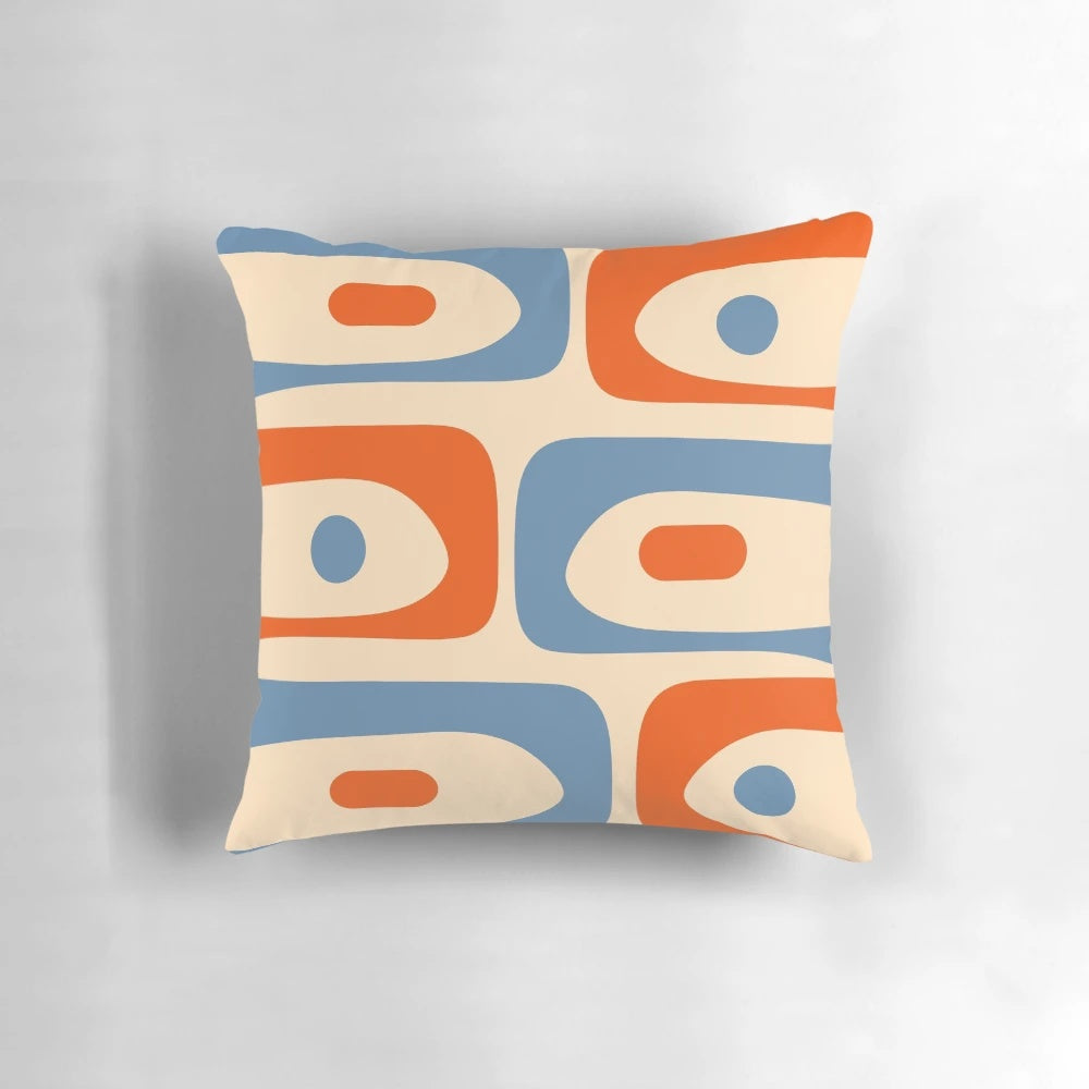 Vibrant mid-century modern patterned pillow in shades of orange and blue