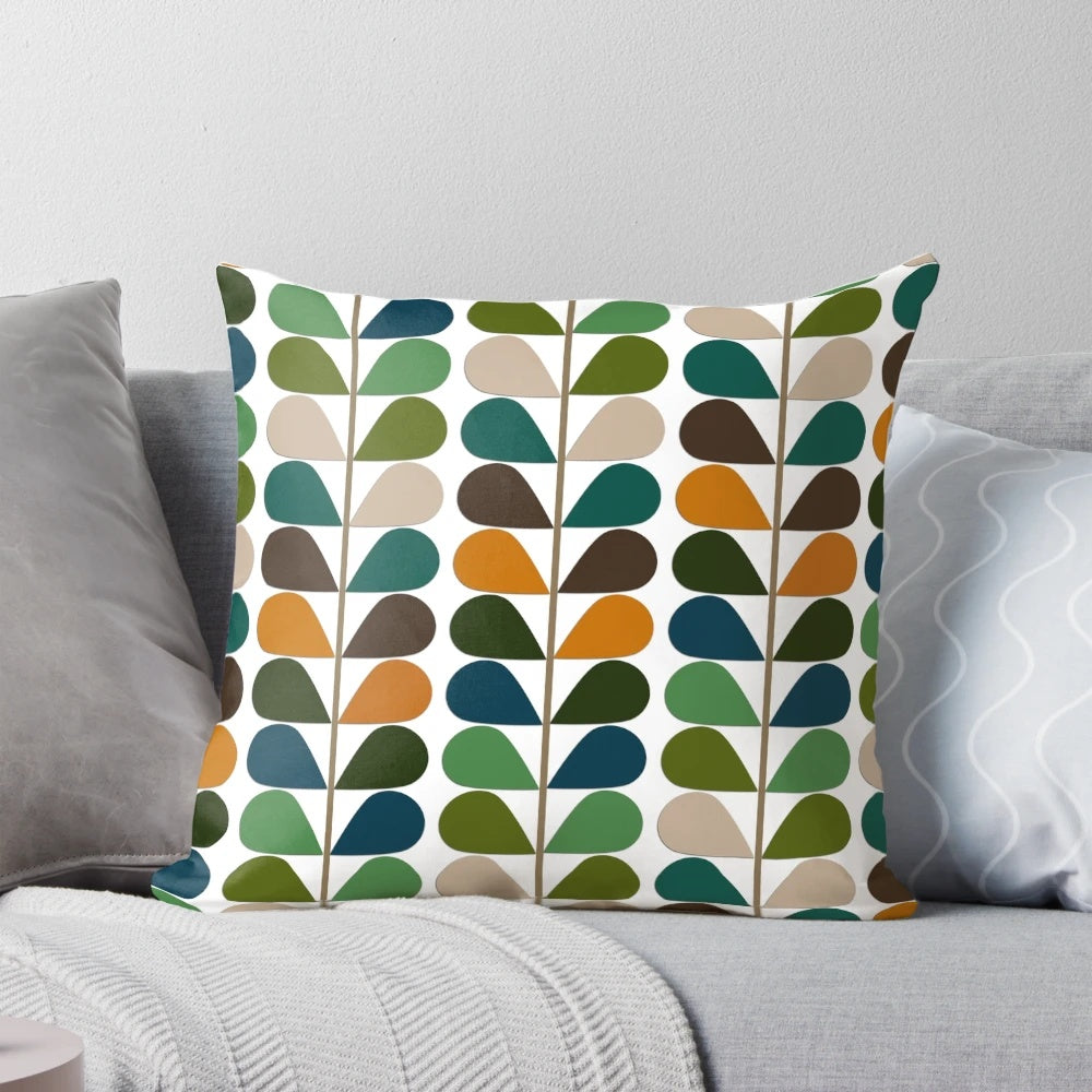 Retro mid-century modern patterned throw pillow in shades of blue, orange, and white.