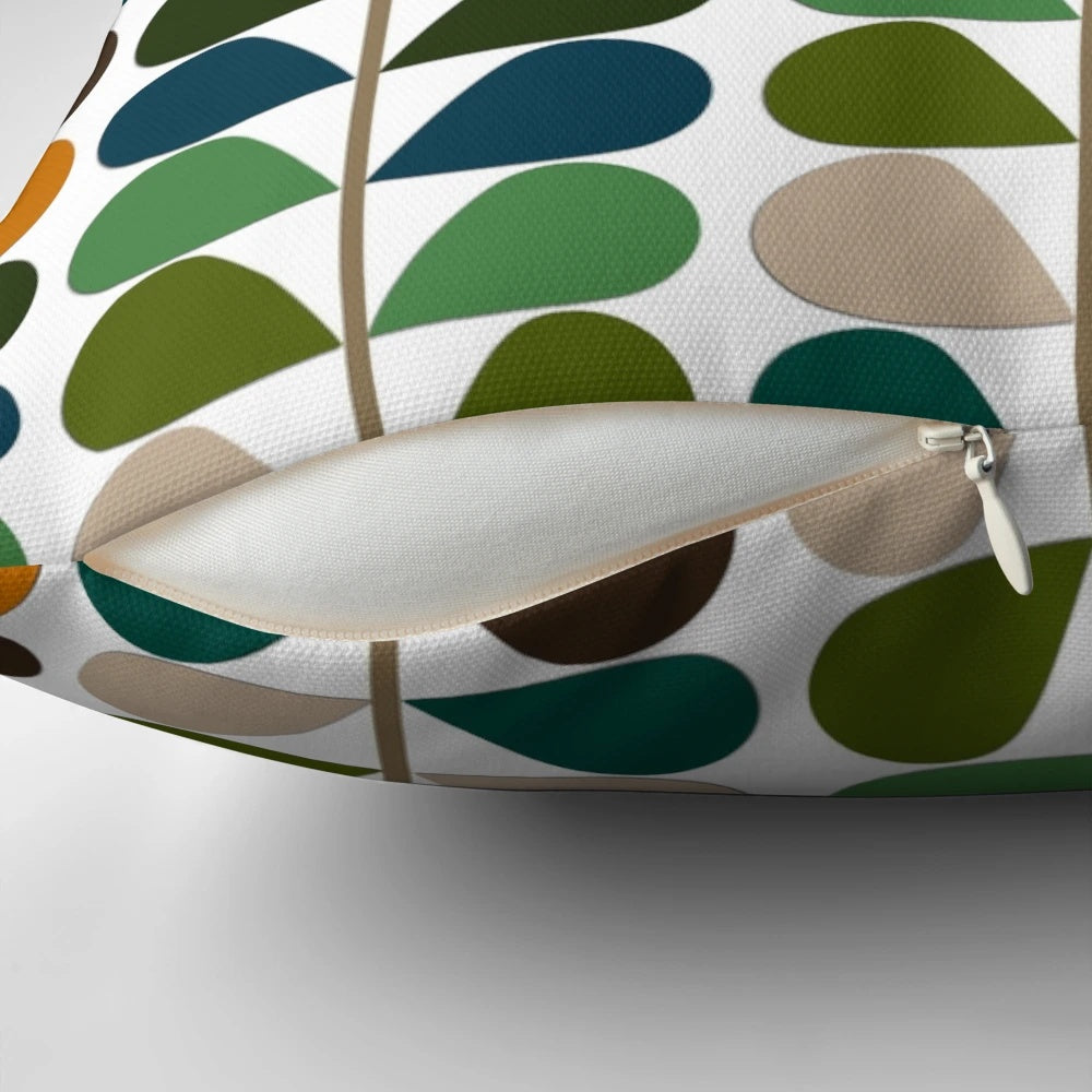 Retro mid-century modern patterned throw pillow in shades of blue, orange, and white.
