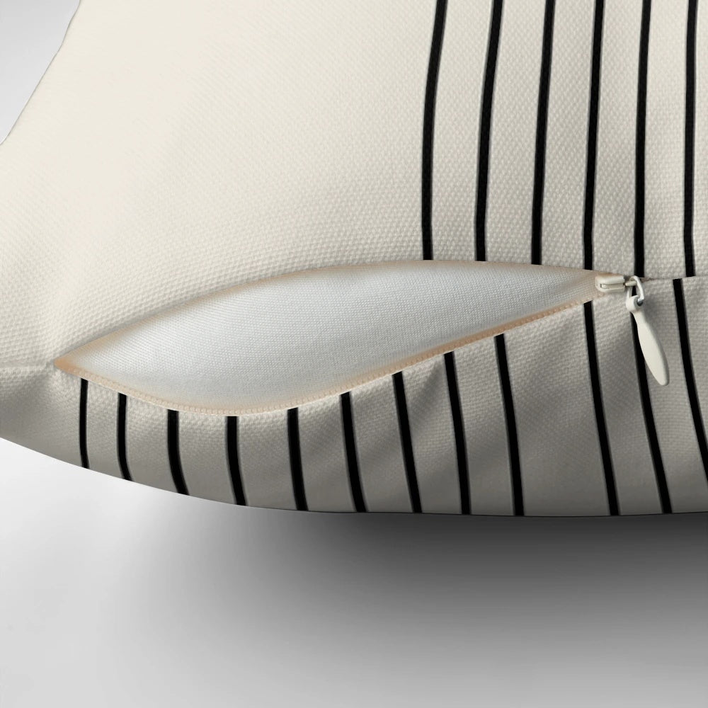 A minimalist mid century style pillow featuring a green arched line design in a modern, abstract aesthetic.