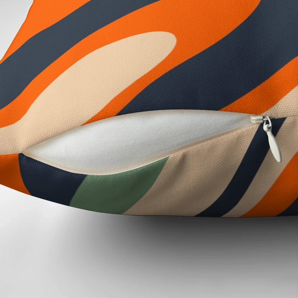 Vibrant abstract pattern in blue, orange, green, and beige tones on a decorative throw pillow with a distorted, trippy visual effect.