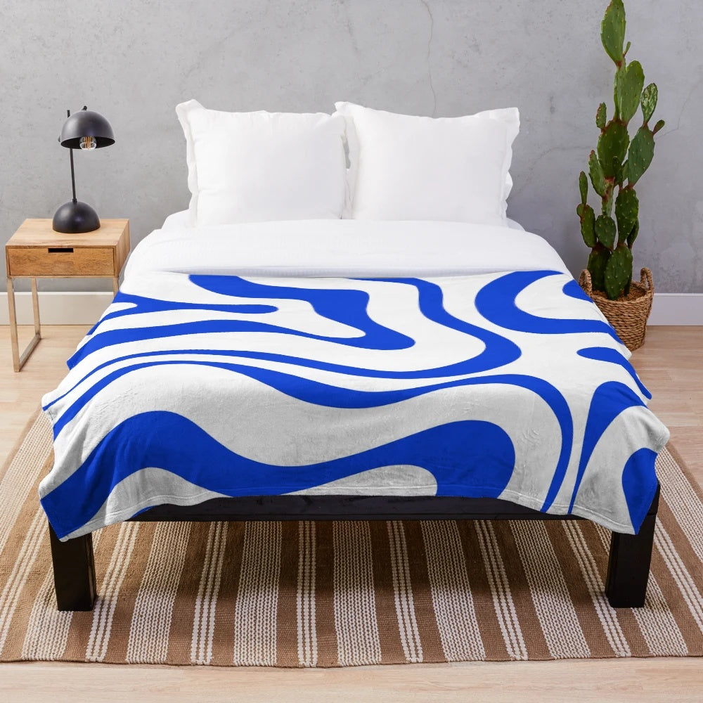 Retro modern plush blanket with abstract liquid swirl pattern in royal blue and white