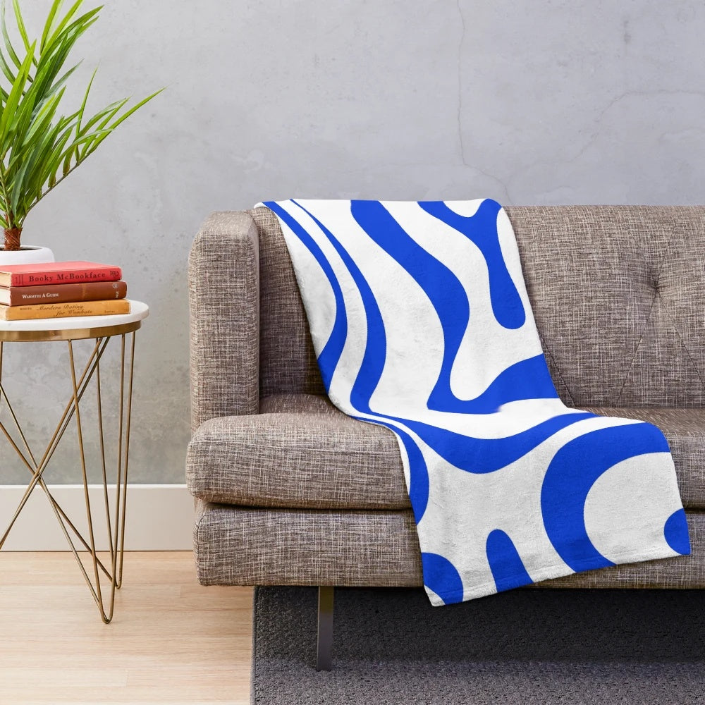 Retro modern plush blanket with abstract liquid swirl pattern in royal blue and white