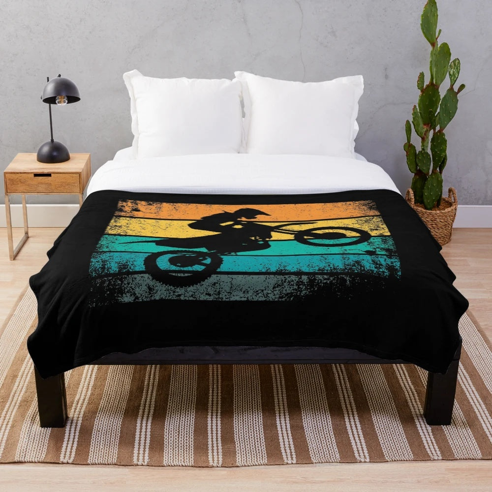 Retro motocross-themed plush blanket with distressed sunset design